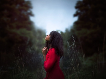 Woman Praying Outside